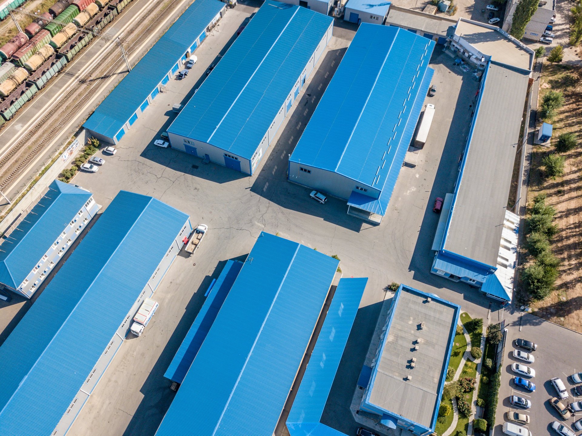 Aerial top view of warehouses hangars near the industrial factory zone