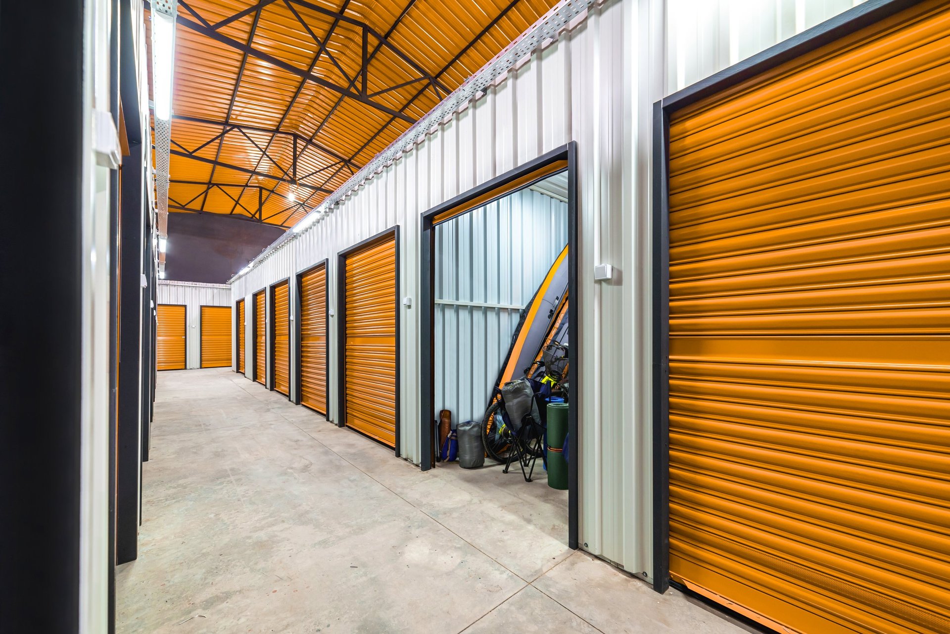Corridor of self storage unit with yellow doors