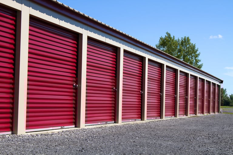 A row of mini rental units for temporary self storage in an outdoor setting